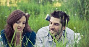 Couple lying in grass