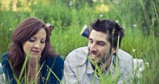 Couple lying in grass