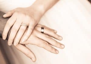 couple hands with rings