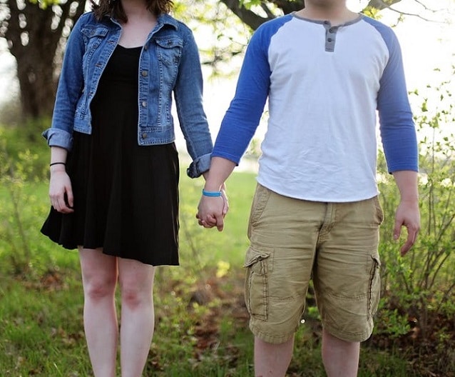 couple lovingly holding hands