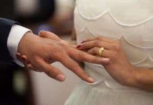 couple wearing wedding ring