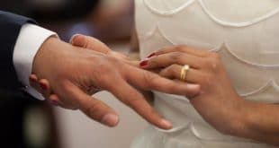 couple wearing wedding ring