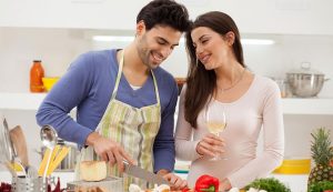 Husband cooking for wife