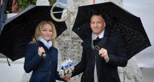 couple in black umbrellas