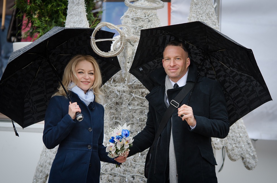 couple in black umbrellas