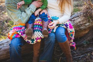 couple with baby in boots