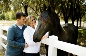 happy couple with horse