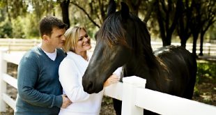 happy couple with horse