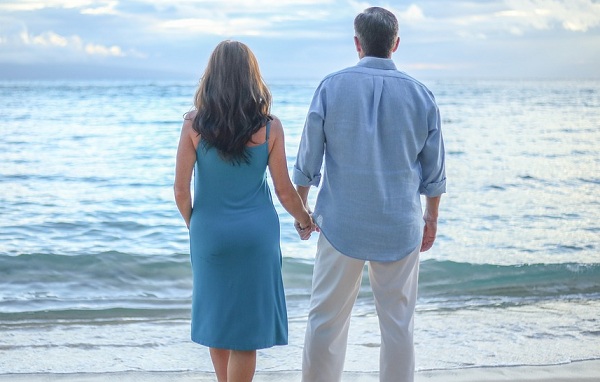 holding hands at the beach