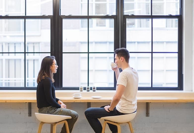 man and woman taking cofee