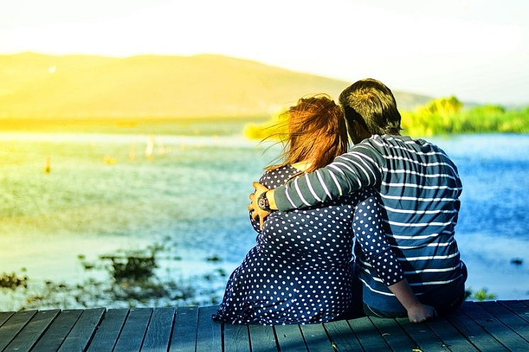 man hugging his woman