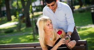 man presenting flower to his love