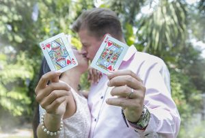 married couple showing cards