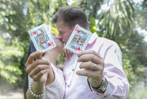 married couple showing cards