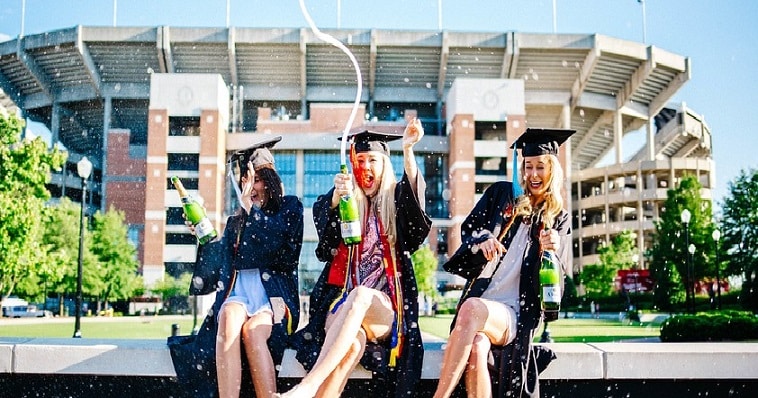 students celebrating graduation